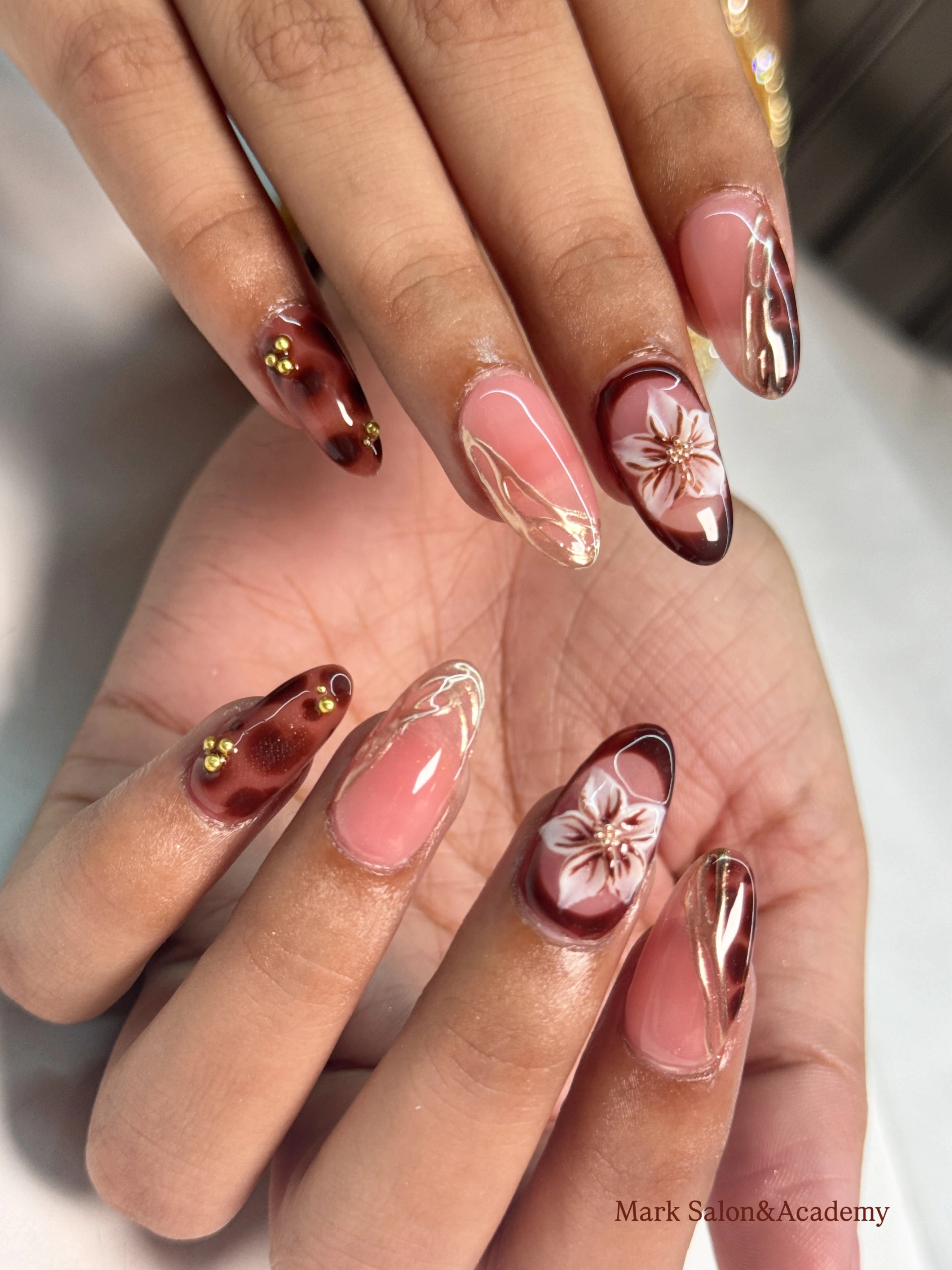 Acrylic nail extension with 3D flower art and gold studs at Mark Salon, best ladies nail care salon in Hoshiarpur